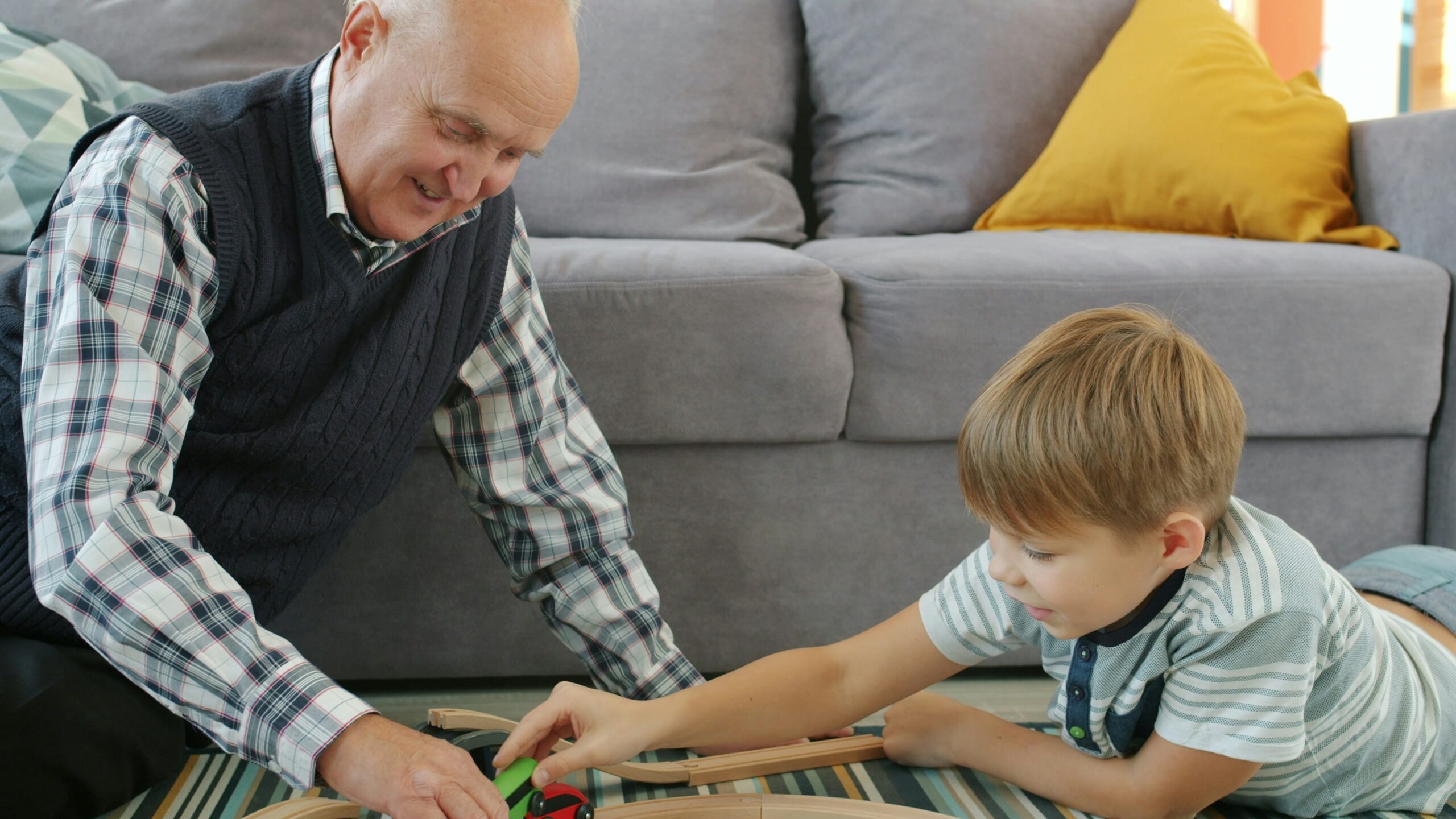 Old man & grandson playing
